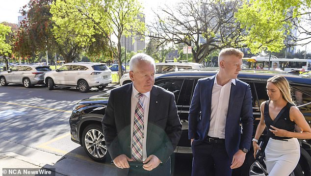 South African Police Commissioner Grant Stevens is seen arriving with his family at court on Thursday.