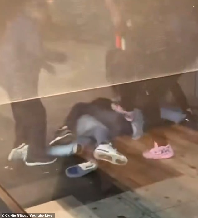 A restaurant filmed the kicks as the 20-year-old lay helpless on the ground.