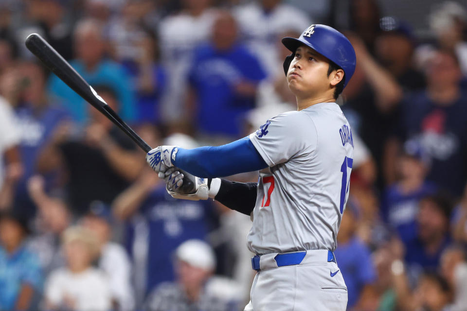 MIAMI, FLORIDA - SEPTEMBER 19: Shohei Ohtani #17 of the Los Angeles Dodgers hits a two-run home run, his 50th of the season, becoming the first player with a 50/50 season in MLB history, during the seventh inning against the Miami Marlins at CreditDepot Park on September 19, 2024 in Miami, Florida. (Photo by Megan Briggs/Getty Images)