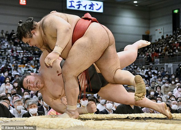 Takayasu, seen here wearing a red loincloth, called a mawashi, is another wrestler who has been forced to withdraw from the fall season due to back problems.