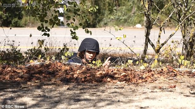 Williamson could be seen delivering her report from the ground while surrounded by bushes as explosions went off in the distance.