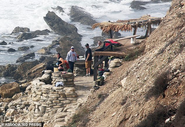 The group, called the 'Bay Boys,' has operated from their elaborate meeting place (seen here) at the base of this cliff along Palos Verdes Estates for decades, a lawsuit alleges.