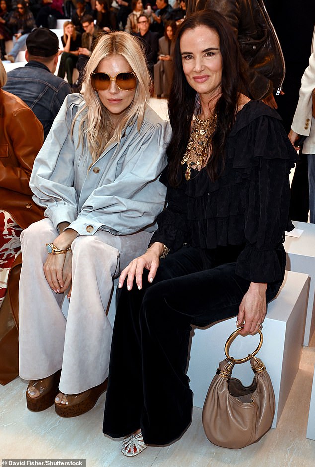 Sienna Miller and Juliette Lewis front row at the Chloe show on September 26 for Paris Fashion Week, where Spring Summer 2025 clothing was presented in suede.