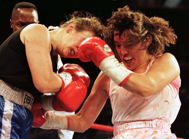 Christy lands a punch on opponent Andrea DeShong during the WBC Women's Lightweight Championship on June 28. She retained her title in the seventh round.