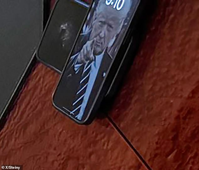 When zoomed in, it becomes clear that the image on the lock screen is Trump from July 19, 2019, when he was still in office.