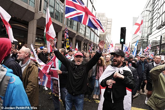 Far-right protesters walk through London on Saturday in a rally backed by Robinson