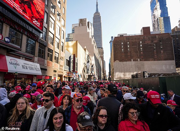 People gather outside Madison Square Garden on the day of a rally for Republican presidential candidate and former U.S. President Donald Trump, in New York, U.S., October 27, 2024. REUTERS/David Dee Delgado