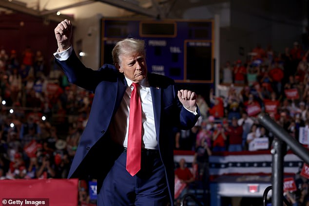 Trump dances on stage at his rally in Greenville on Monday.