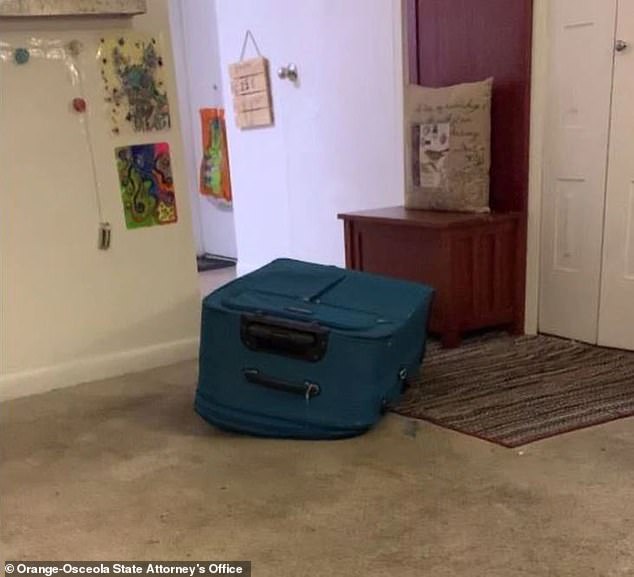 This screenshot of a cell phone video allegedly recorded by Sarah Boone shows the blue suitcase where Jorge Torres Jr suffocated to death after being zipped inside.