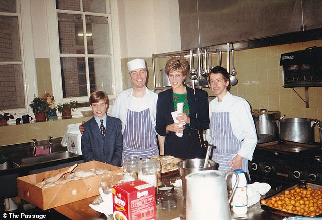 He also seemed cheerful after helping with Christmas dinner, posing for a photo with the shelter's cooks.