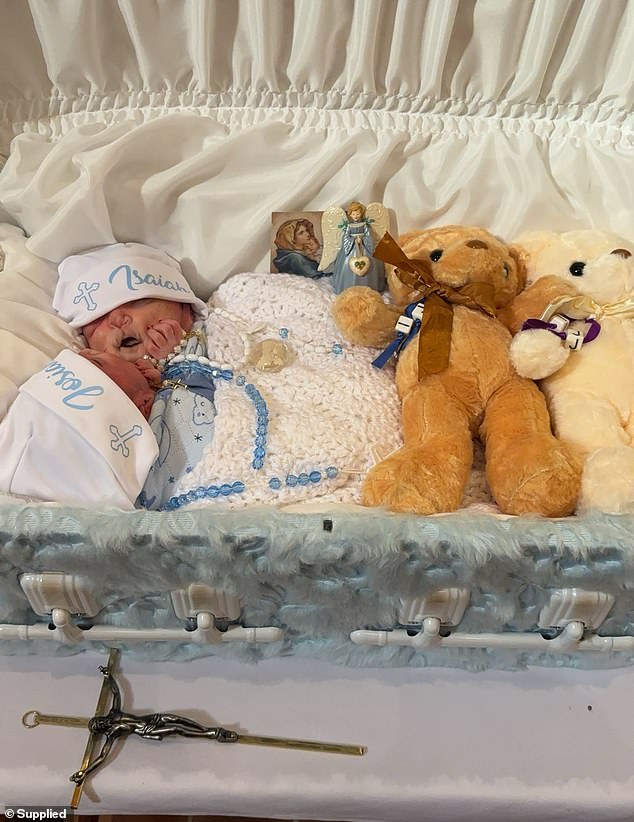 The deceased twins received an open-casket funeral and then burial on Thursday, eight days after their birth and tragically short lives.