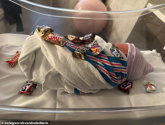 On October 31, she shared a photo of her newborn baby wrapped in a blanket with miniature candy around the crib. 