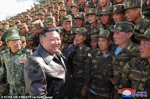 This image, taken on October 2, shows North Korean leader Kim Jong Un (center, left) inspecting a Korean People's Army special operations forces training base.