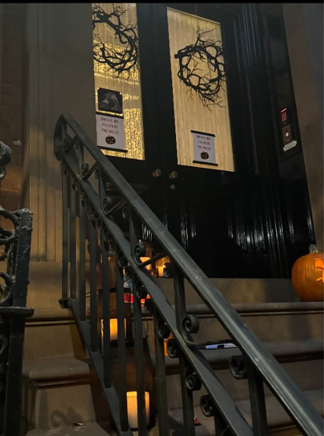 However, as night fell on All Hallows' Eve, images show the porch decorated with nothing more than a few candles and a single pumpkin.