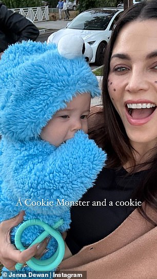 Jenna and Steve took turns holding their adorable daughter while they went trick-or-treating.