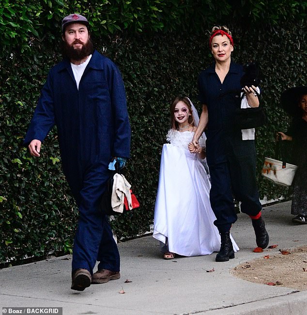 Hudson's fiancé, Danny Fujikawa, 38, joined the mother and daughter on their candy-hunting trip dressed in a denim jumpsuit, a white T-shirt and brown boots.