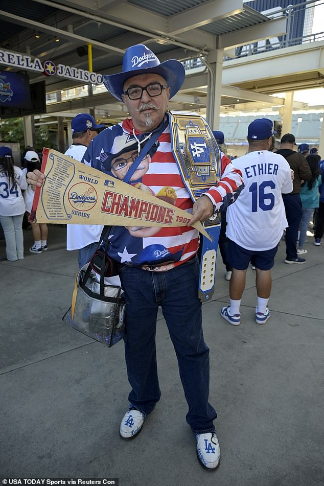 Many fans dressed in Dodger gear including pennants, belts, caps and shoes.