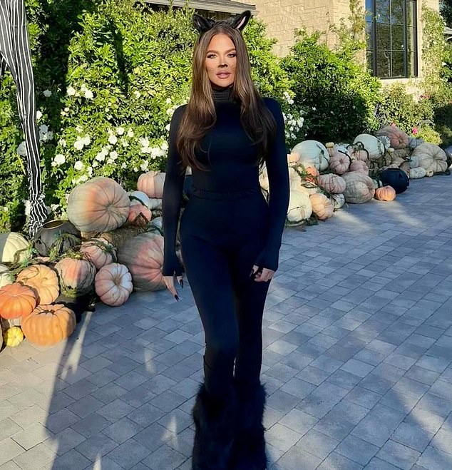 The Keeping Up With The Kardashians veteran was dressed like a black kitten in a skin-tight belted black suit.