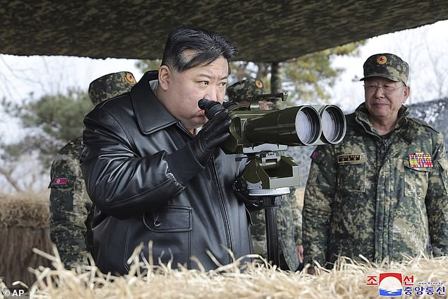 File image showing dictator Kim Jong Un supervising artillery firing exercises in North Korea in March.