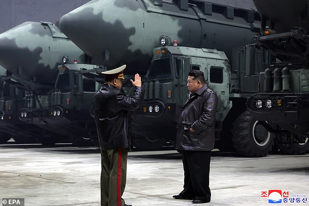 A photograph released by North Korea's official Korean Central News Agency (KCNA) on Oct. 23, 2024 shows North Korean leader Kim Jong Un (R) inspecting strategic missile bases.