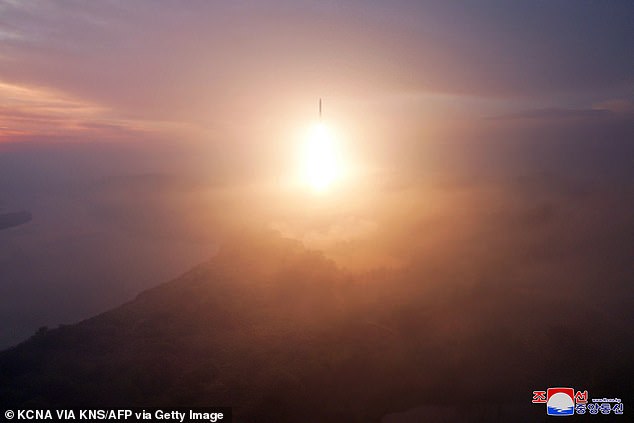 This image released by North Korea's official Korean Central News Agency (KCNA) on October 31 shows the launch of an intercontinental ballistic missile (ICBM) during a test fire.