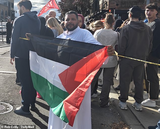 Fawzy Mohamad unfurled a Palestinian flag as part of a protest in front of Trump's visit.