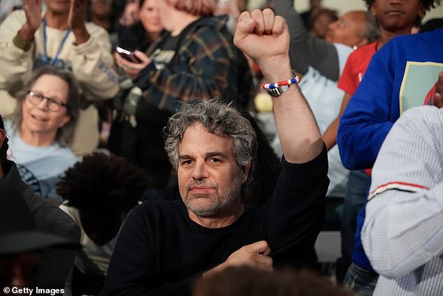 Mark Ruffalo, who plays Hulk in 'The Avengers', applauds as Democratic presidential candidate and US Vice President Kamala Harris speak to supporters at the Alan Horwitz 'Sixth Man' Center on October 27, 2024 in Philadelphia, Pennsylvania.