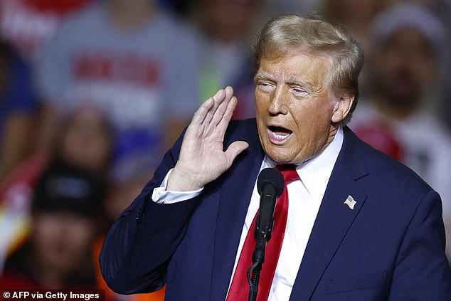 Former president and Republican presidential candidate Donald Trump gestures as he speaks at a campaign rally at the Fiserv Forum in Milwaukee, Wisconsin, on Nov. 1, 2024. He was asking if people in the audience could hear them after they encouraged fixing the microphone.