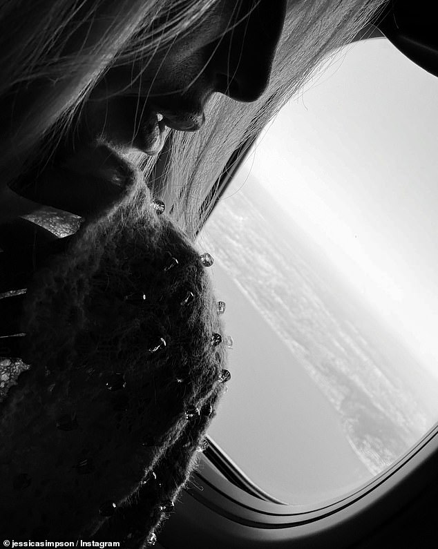 During the flight, she took a photo of herself looking out and admiring the view from her flight's window seat. The Dukes of Hazzard star posed thoughtfully with her hand on her chin