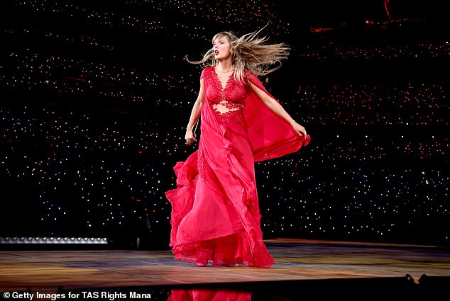 For the Folklore and Evermore segment of her concert, she looked stunning in her scarlet red dress and the flowy cape cascading around her.