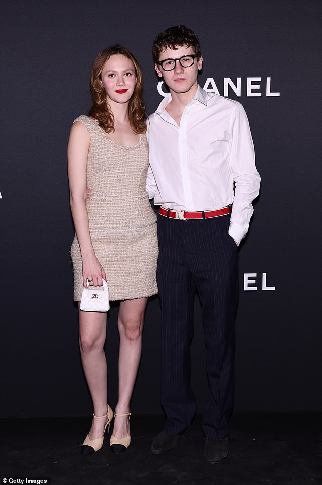 Showing off her legs in Chanel with Sam Nivola, who is the son of actors Emily Mortimer and Alessandro Nivola