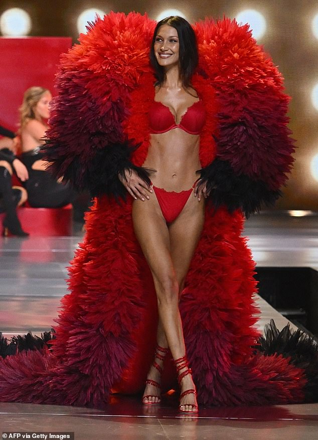 Cher performs as model Bella Hadid walks the runway during the 2024 Victoria's Secret Fashion Show at Duggal Greenhouse.