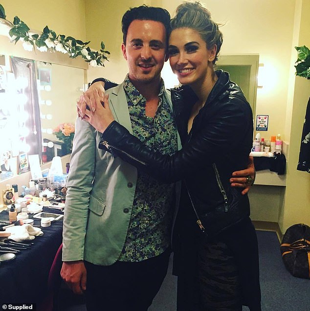 After waiting a week, which felt like a month, to see his regular doctor, Mark breathed a sigh of relief when he was told the cancer had been caught early, was treatable and was only at stage one (pictured with Delta Goodrem) .