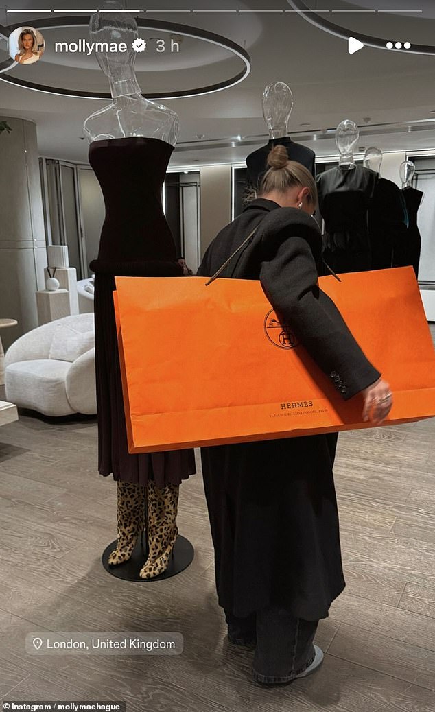 The television personality shared some images of her day at the luxury department store where she splashed out the cash and could be seen with a huge orange Hermes bag over her shoulder.