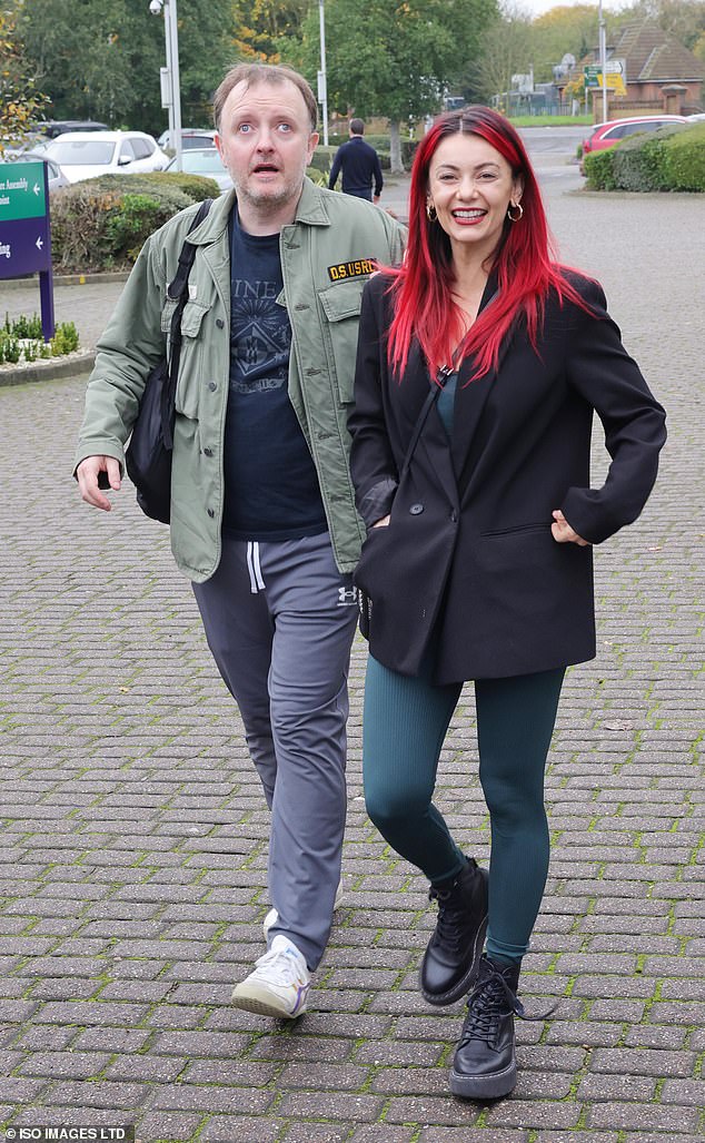 Comedian Chris McCausland, 47, and his professional dance partner Dianne Buswell, 35, appeared in high spirits as they walked side by side.