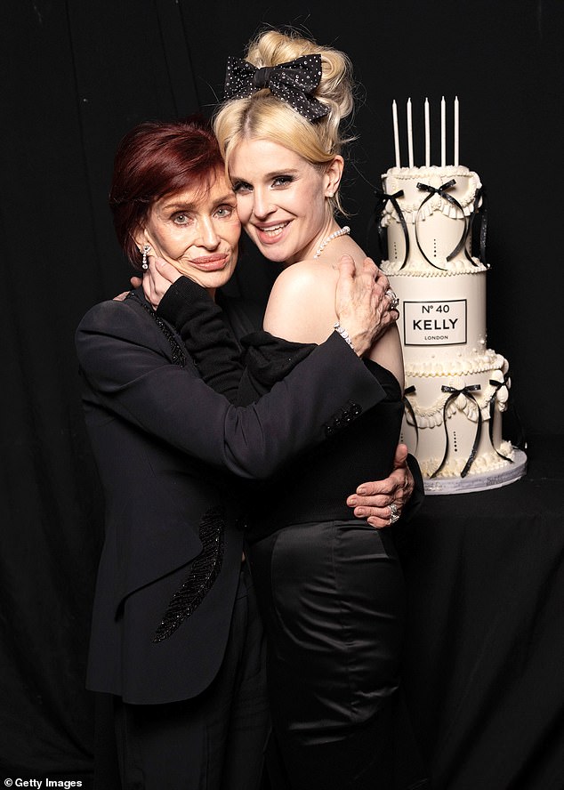 Kelly seemed in good spirits as she gave her mother Sharon Osbourne a hug at the event.