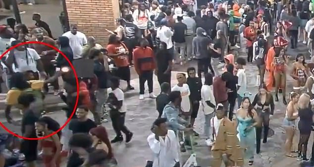 Police have released footage of the moment he allegedly opened fire on the crowd.