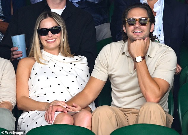 The delighted grandparents are now preparing to fly to Los Angeles to welcome the new arrival. Pictured: Margot Robbie and Tom Ackerley at Wimbledon in July