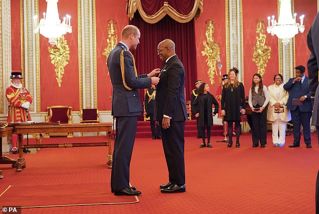 Ian Wright being appointed OBE by the Prince of Wales at Buckingham Palace