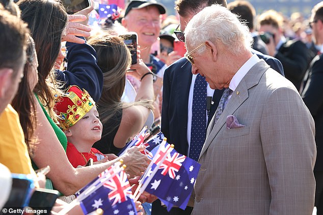 A child was among the spectators greeting the King during his visit to the Sydney Opera House on October 22.