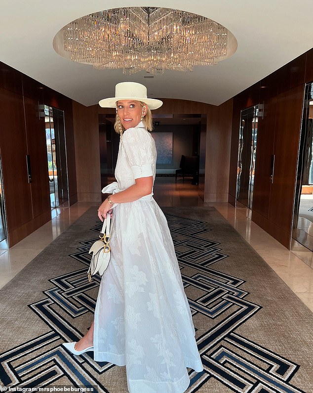 The sheer white fabric had lace details and an elegant buttoned neckline. In the grand tradition of racing fashion, Phoebe opted for statement hats.