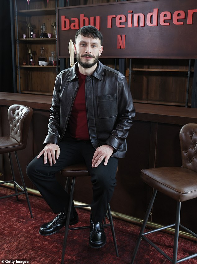 Richard opted for a smart casual look and donned a leather jacket over a red sweater.