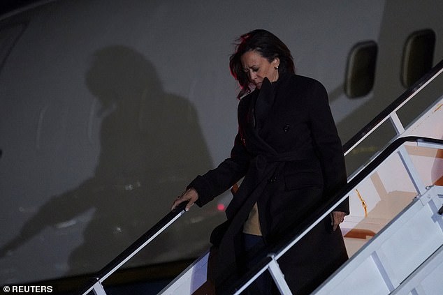 Harris disembarks from Air Force Two to begin his surprise stop in New York City on Saturday night.