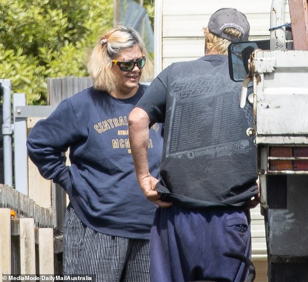 Pictured: Jacinta King and Jamie McCulloch outside their caravan on Thursday.