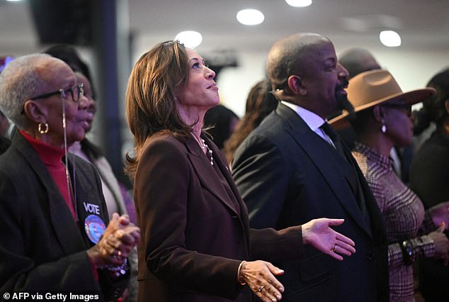 Harris applauds during a service at the Church of Christian Compassion in Philadelphia, Pennsylvania, just nine days before the 2024 presidential election.