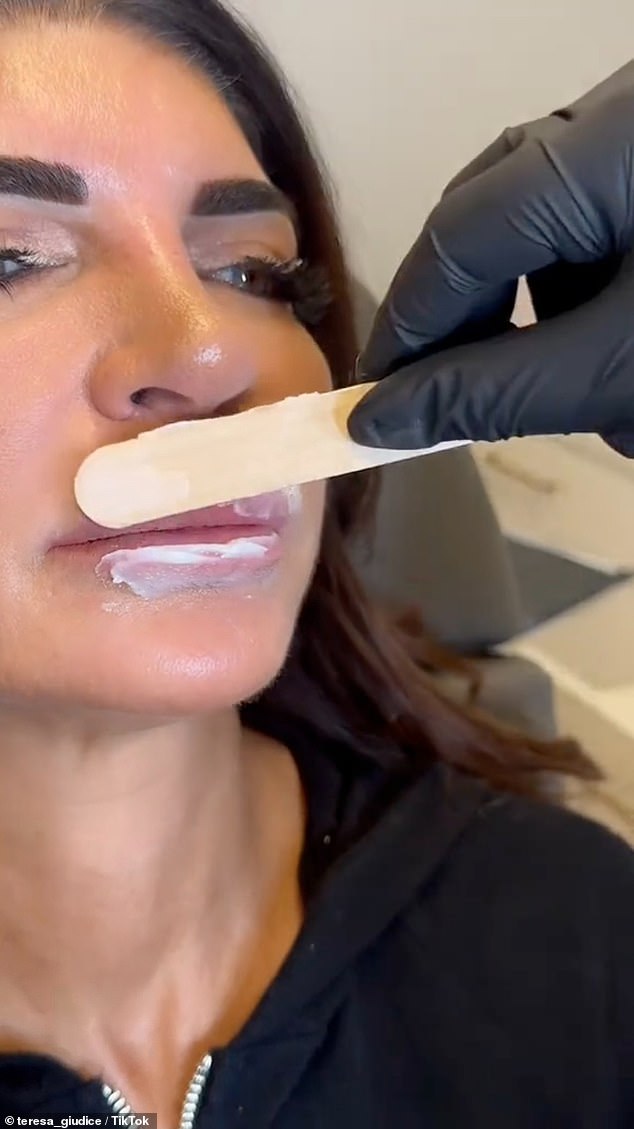 She sat on the treatment table and fans watched as her lips were prepped with numbing cream and special enzymes that dissolve hyaluronic acid were injected.