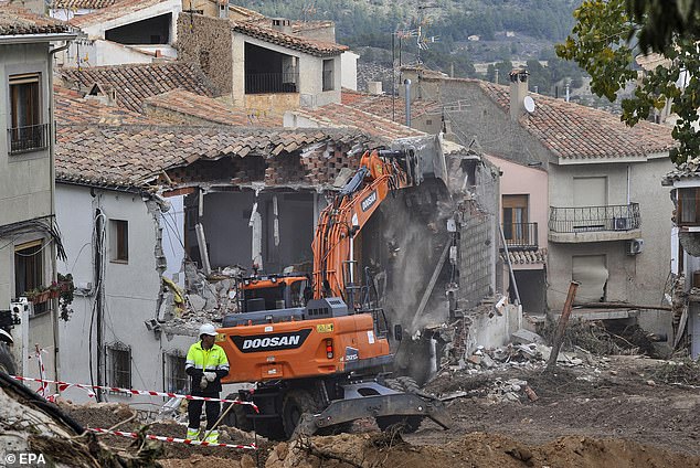 A view of the demolition work of a house damaged following flash floods in Letur, Albacete province, Spain