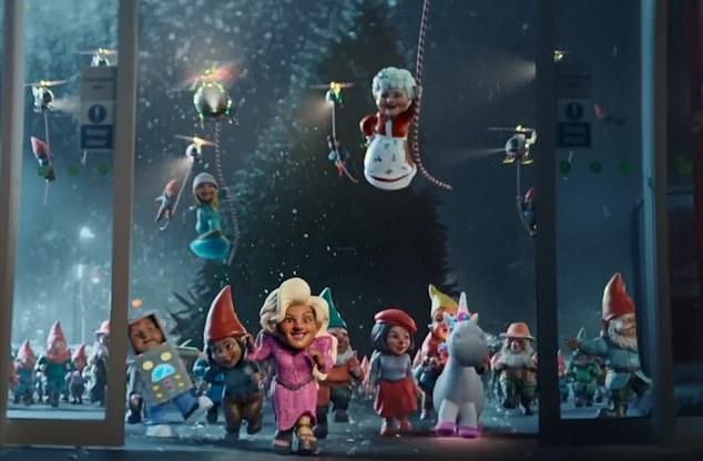 In the pun-filled clip, two supermarket workers enlist the help of dozens of charming gnomes to prepare the store for the holiday season after complaining that 