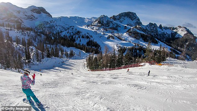 A snowboarder hits the slopes of Nassfeld, Austria