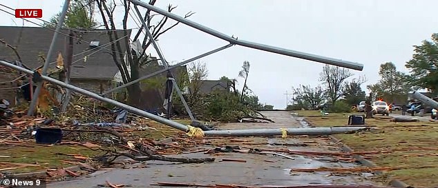 A huge power line fell during the storm and landed on the roof of a house.